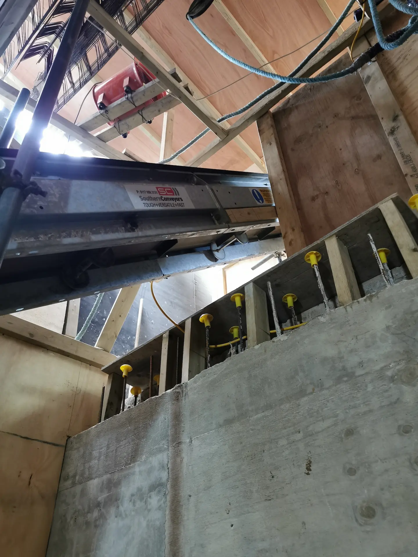 Basement construction in Chiswick with a conveyor belt in use to move ground from the basement, speeding up the excavation process