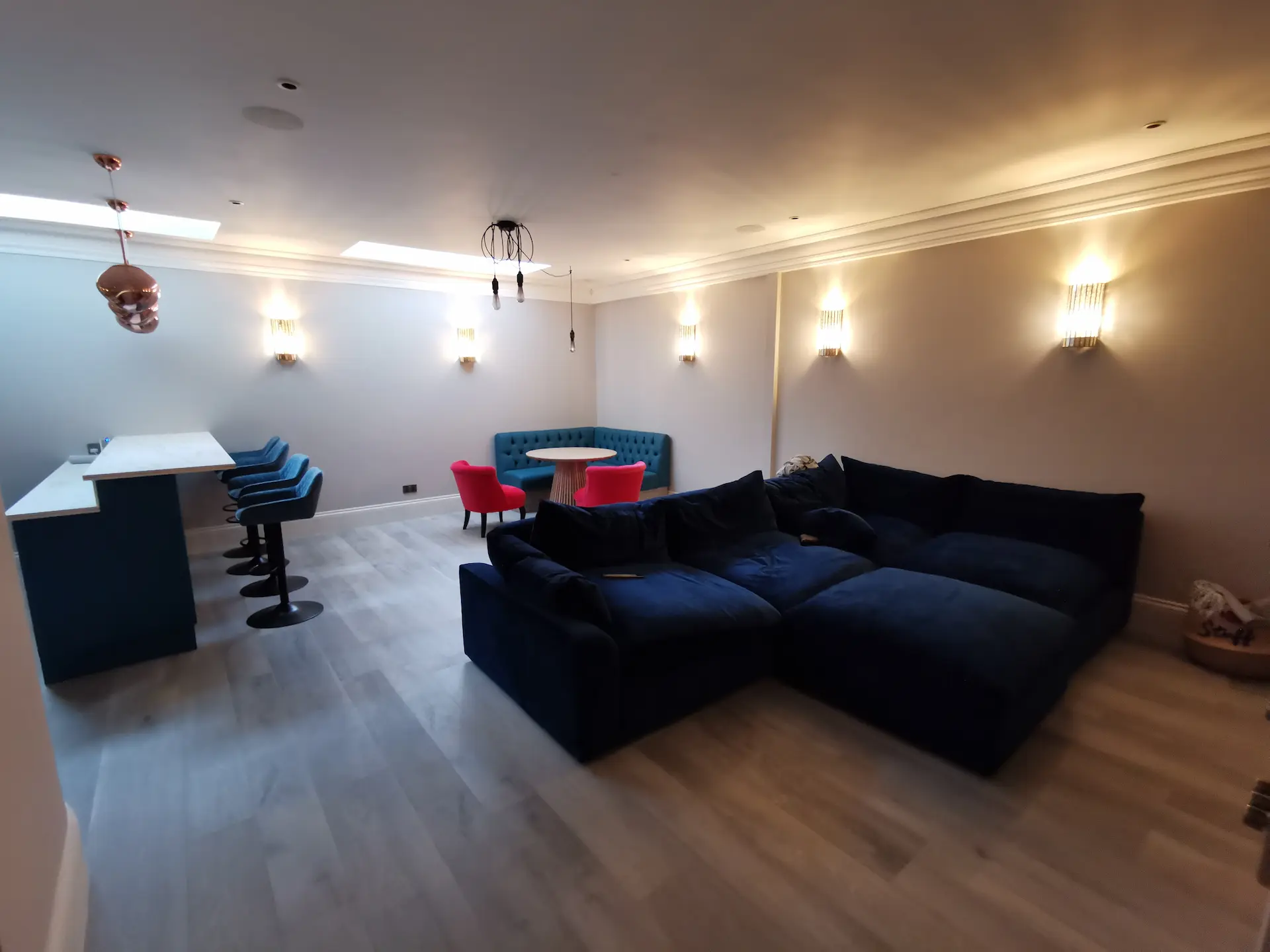 Modern entertainment room in newly finished Chiswick basement