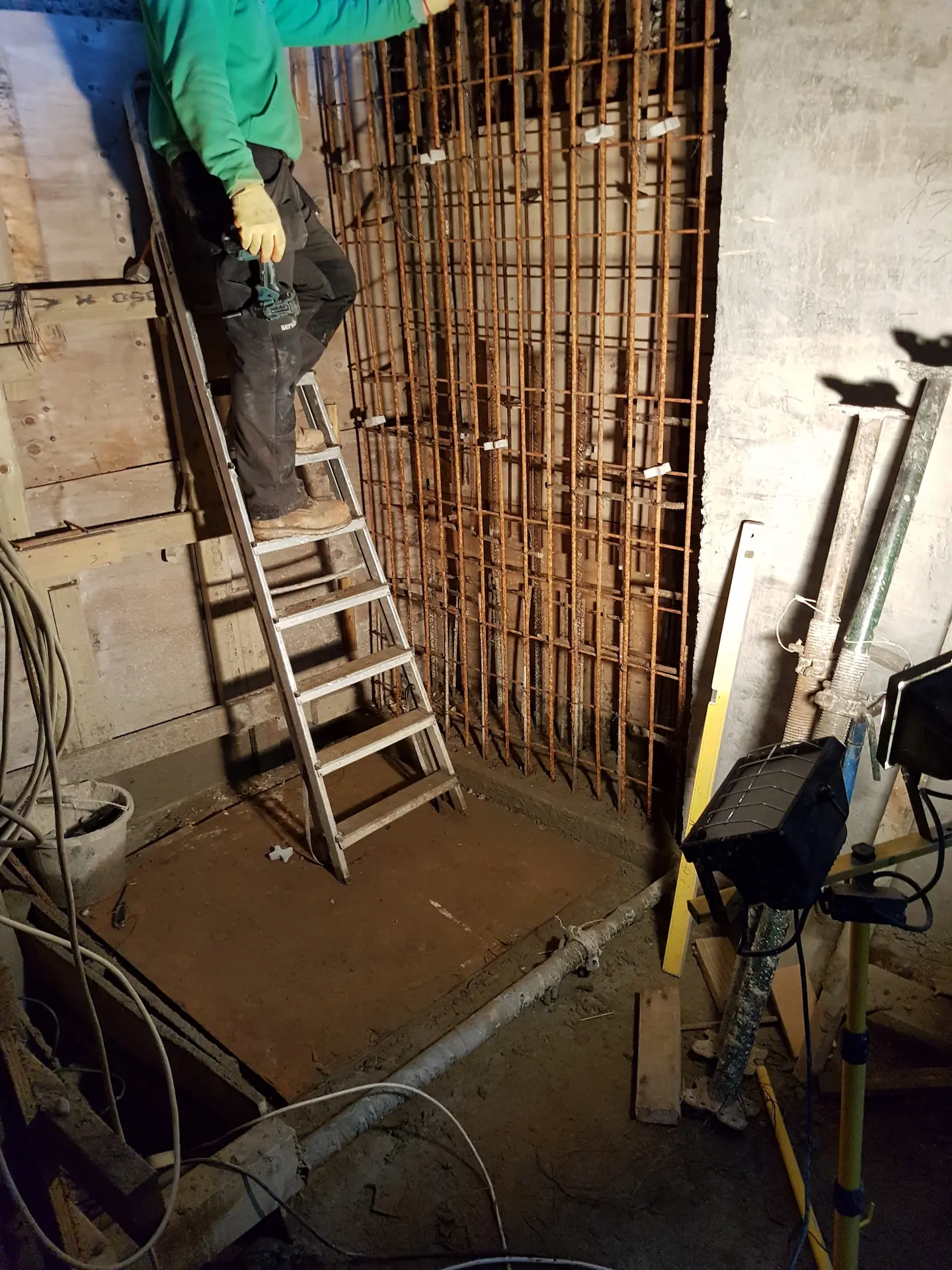 Basement construction in Chiswick showing retaining wall reinforcement installation