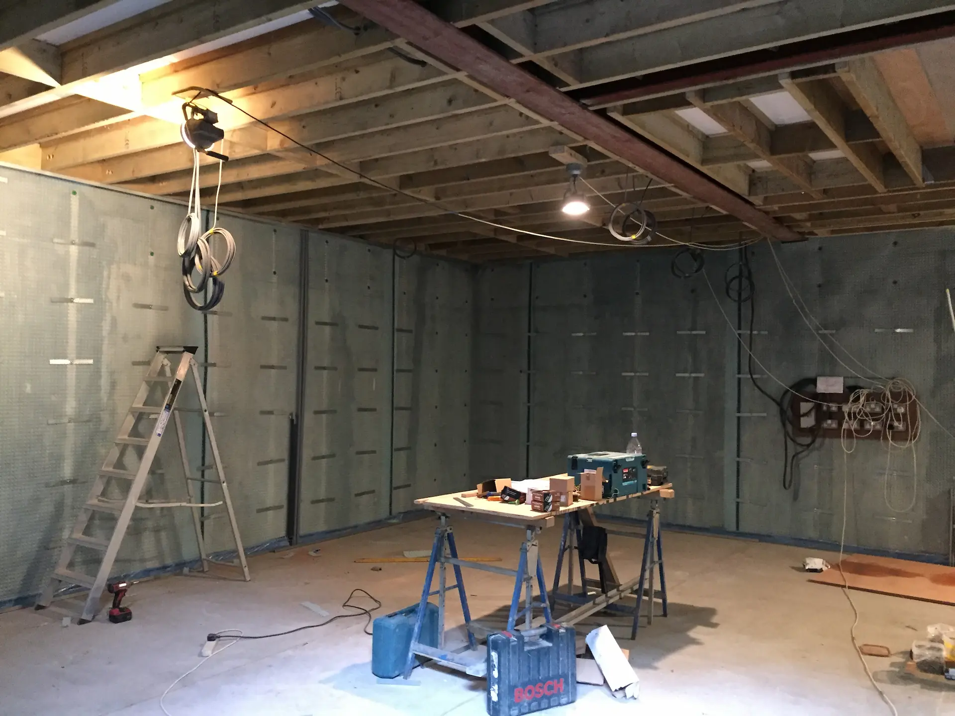Basement construction in Chiswick showing waterproofing with exposed beams and joists