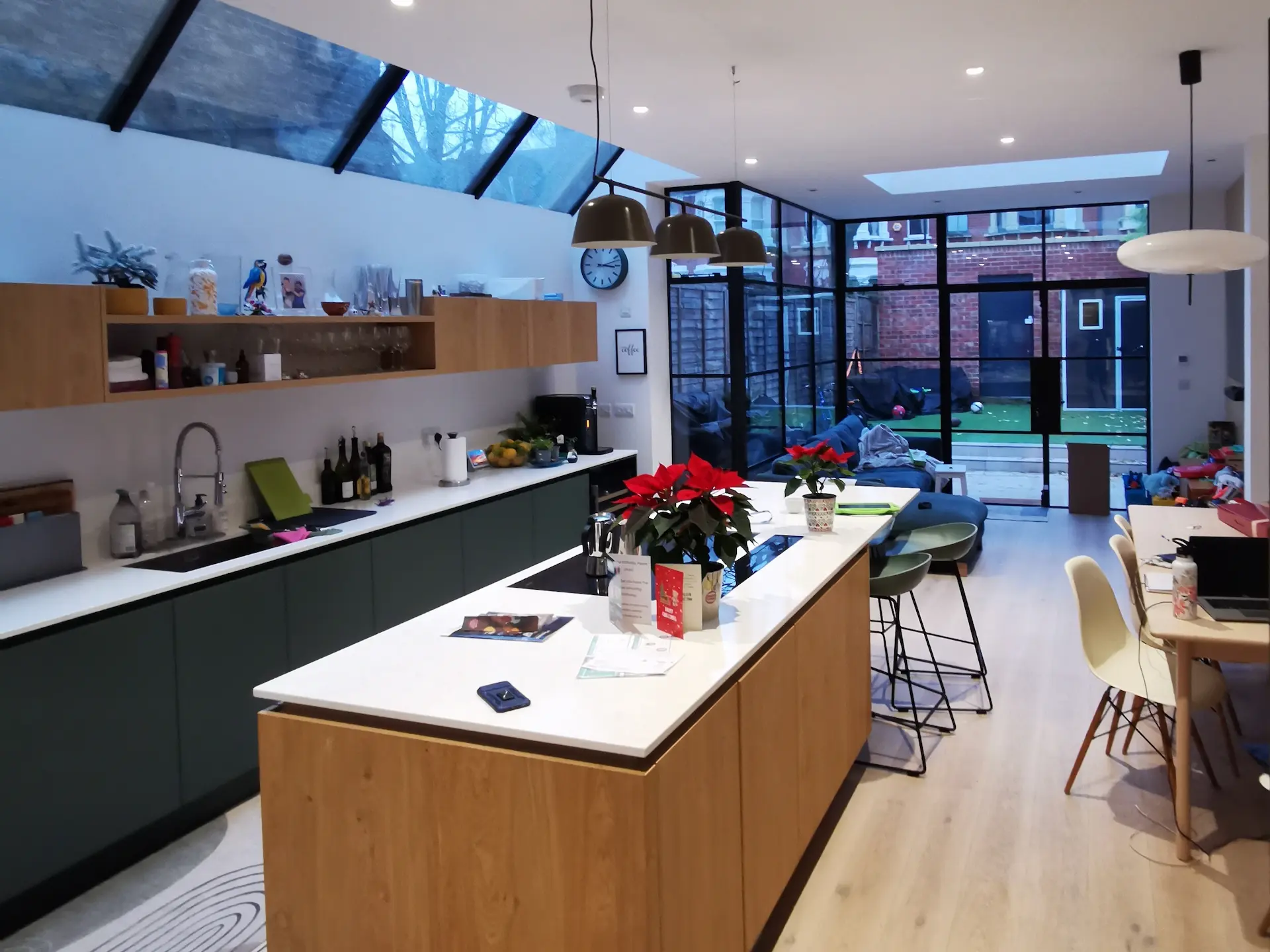 Modern kitchen in Chiswick extension with bespoke side glazing and Crittall doors