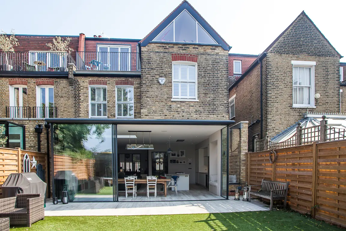 Rear elevation of a renovated Chiswick house extension featuring large glass panels that enhance natural light and modern design