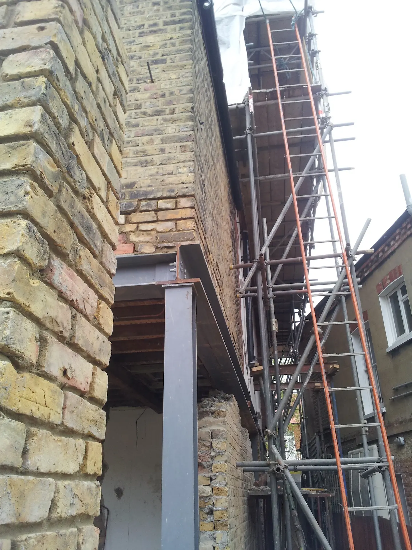 Steel beams and columns were installed during a house extension in West London, with an external wall being removed to expand the living space