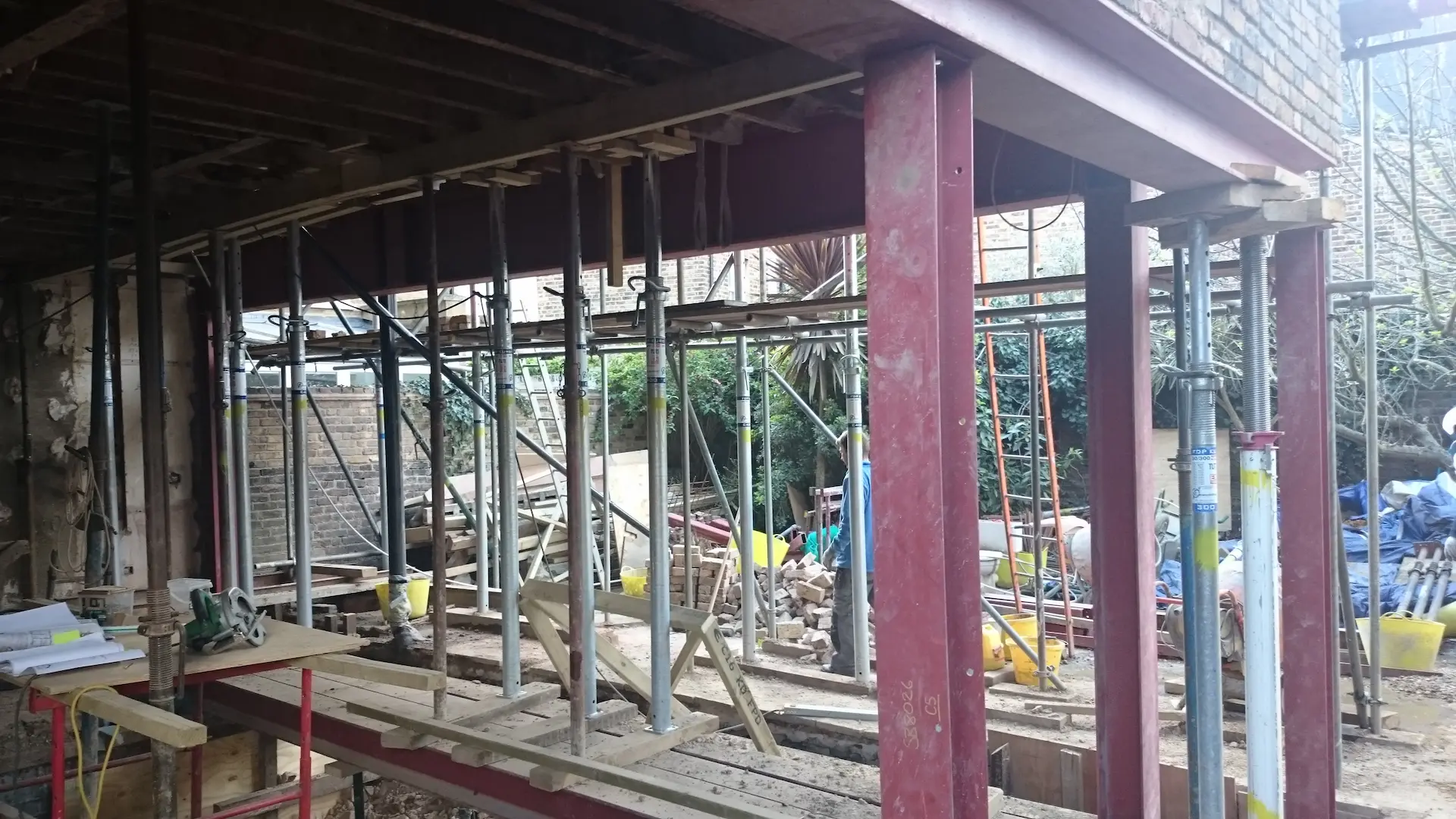 Chiswick house refurbishment showing steel columns, beams, and temporary supports