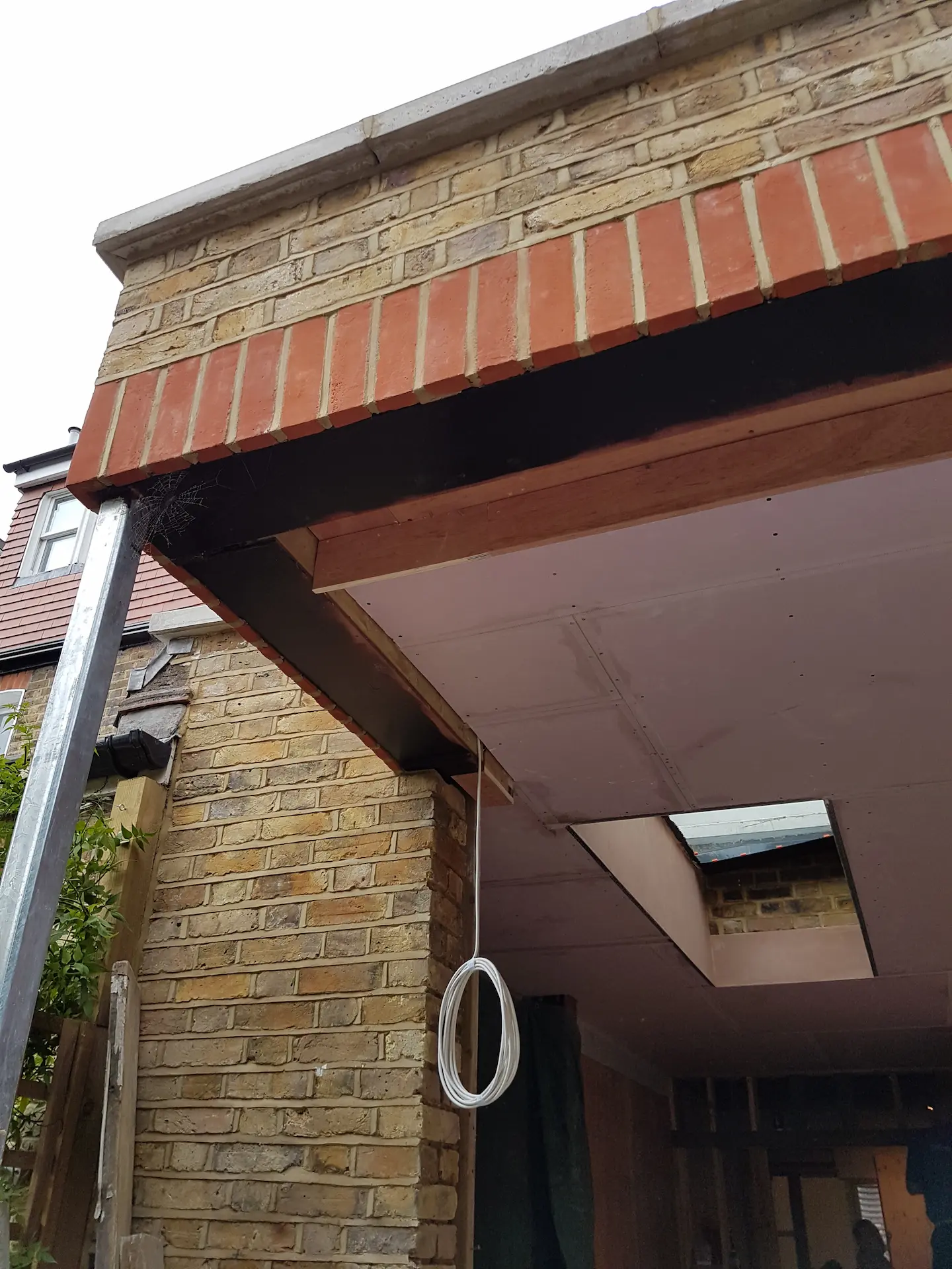 Ealing ground floor extension featuring a galvanised steel column and an opening ready for Crittall door installation