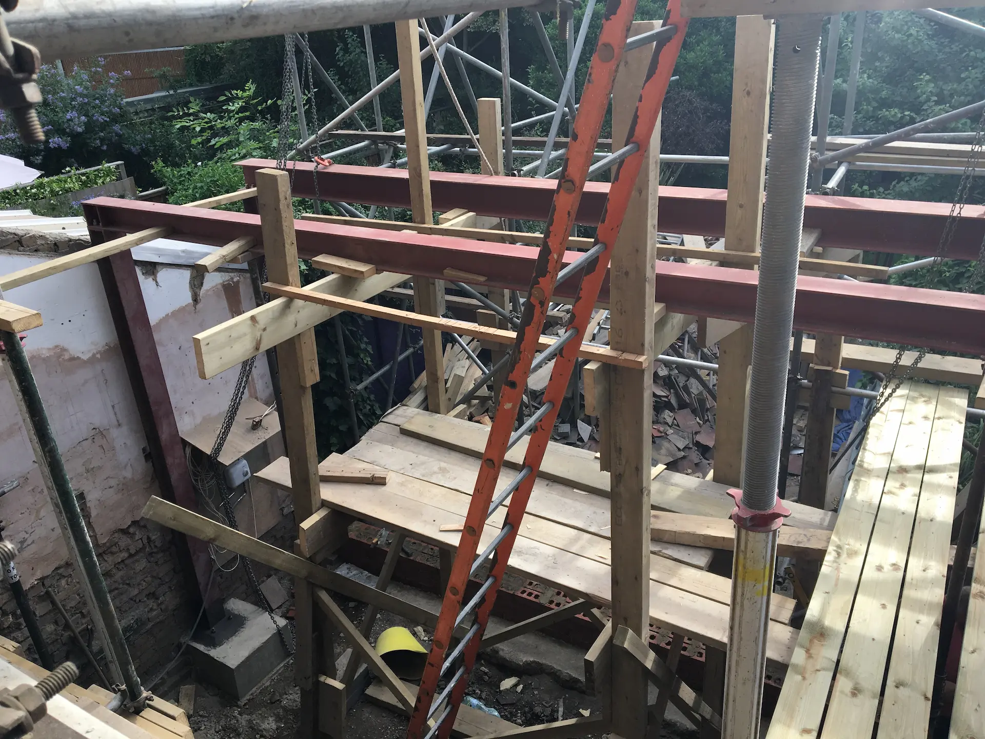 Freshly installed steel frame structure for house extension in Ealing